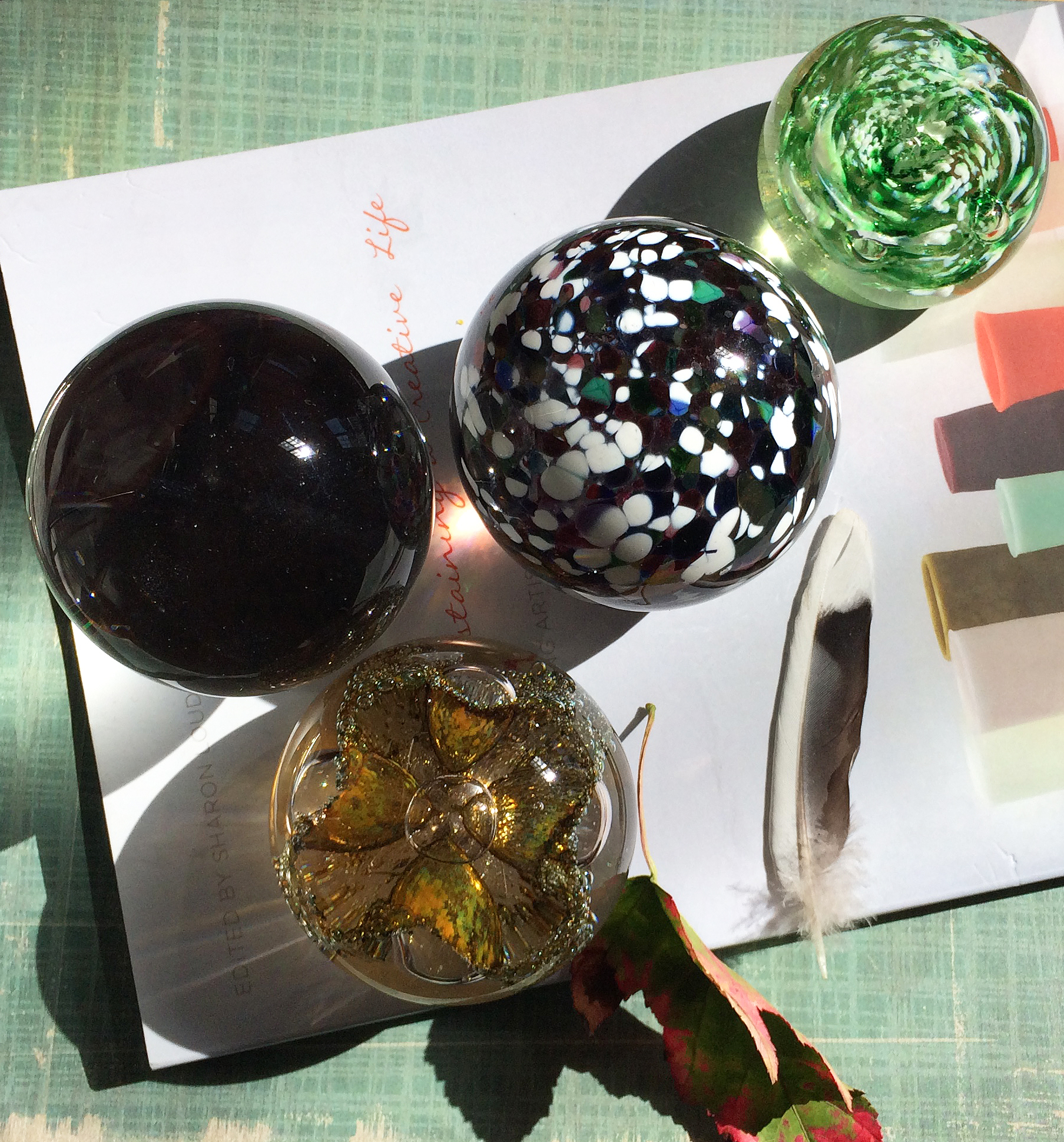 glass orbs and book