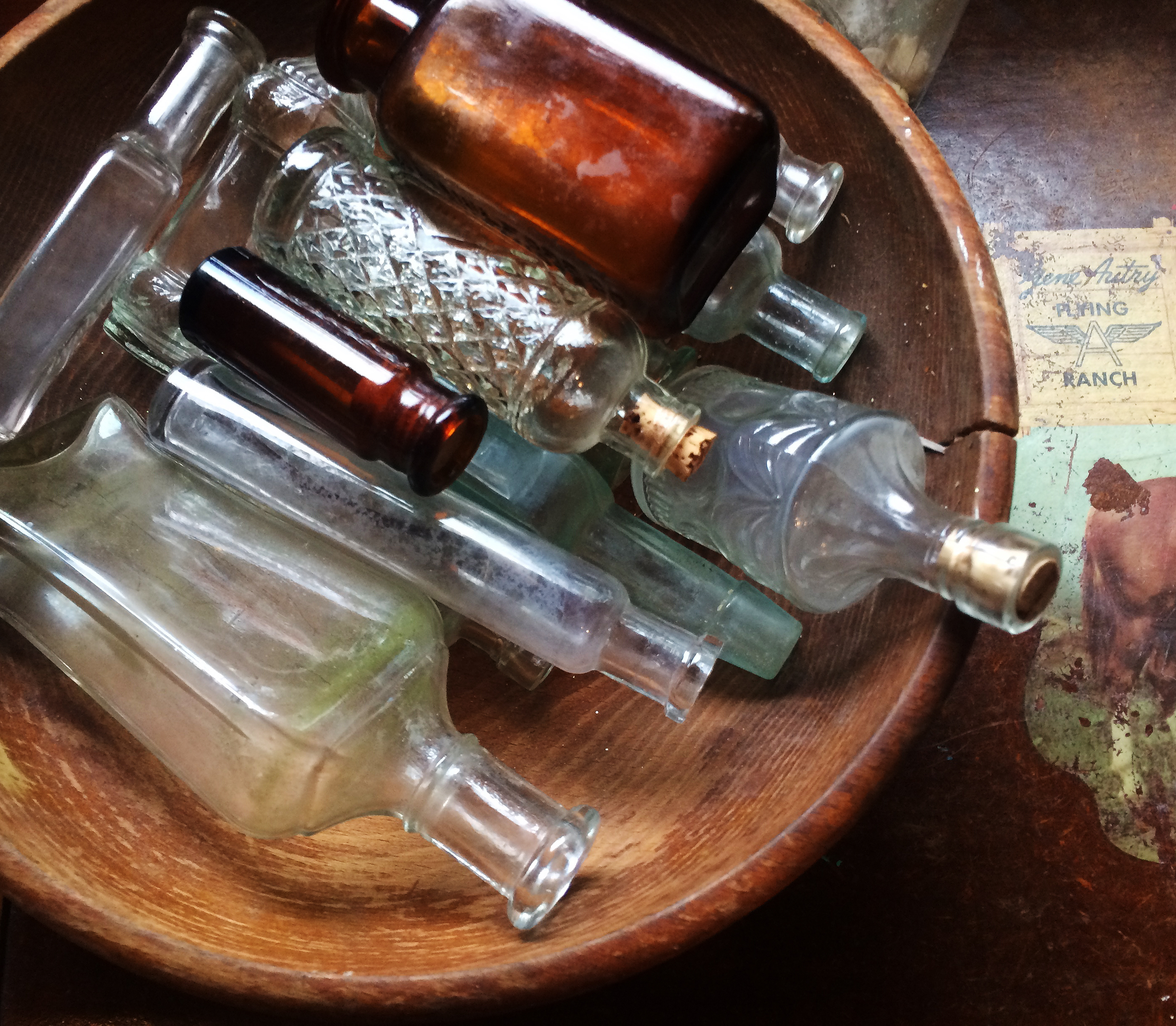 bottles in wooden bowl