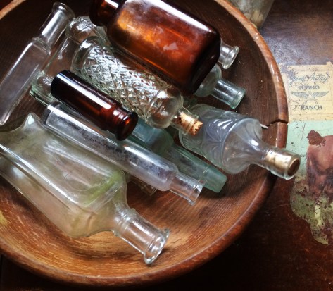 bottles in wooden bowl