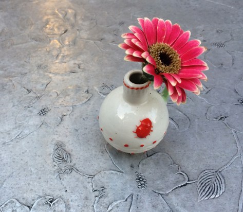little flower on tin table